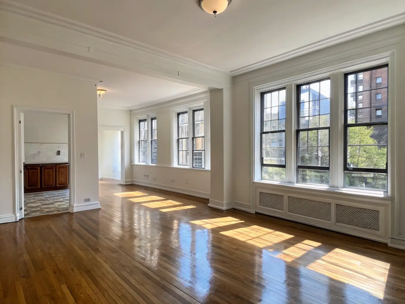 An empty, pristine apartment with freshly cleaned floors and walls, ready for new occupants, illustrating a move-in/out cleaning service.